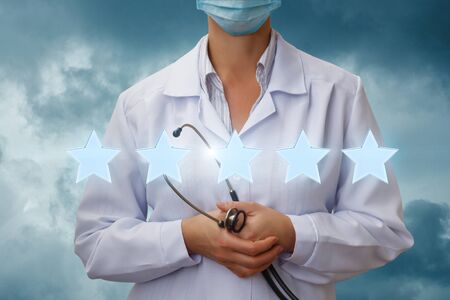 Rating of doctors and medical professionals . Five stars on the background of the doctor.