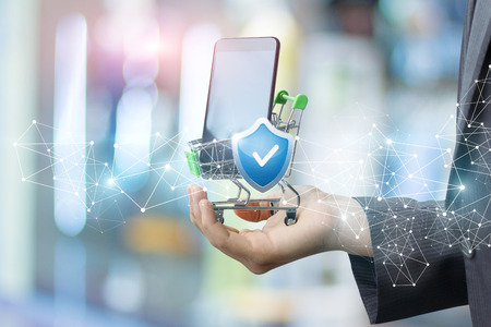 Buying a phone in the online shop protected payment. Concept purchase protection.の写真素材
