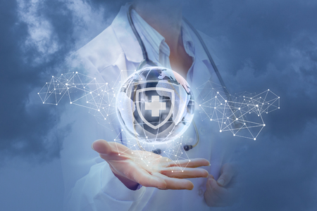 Health of the world in the hands of a medic in the sky.の写真素材