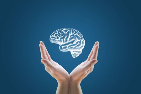 Show hand drawn brain on a blue background.