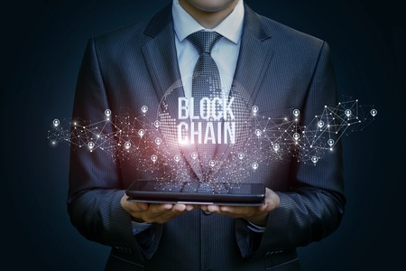 Businessman in the network shows the block chain .The concept of technology transfer money.の写真素材