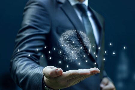 Businessman hand shows the system block chain on a blue background.の写真素材