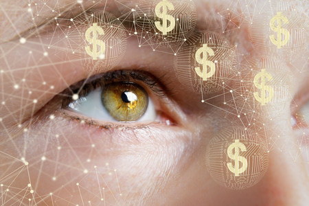 A business woman watches the network for electronic money.の写真素材