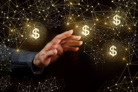Hand of a businesswoman and electronic dollars in the network.の写真素材
