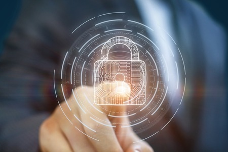Businessman clicks the lock on the virtual screen. The concept of protection.