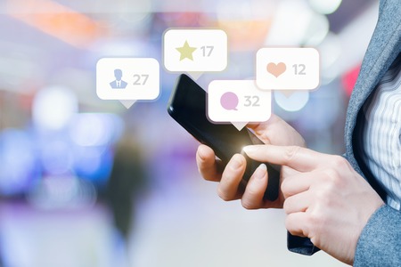 Social media in the mobile phone business woman.