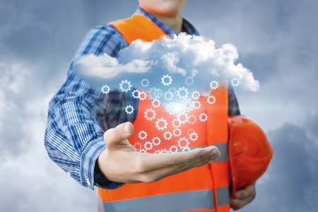 Repairman in the hands shows the process of setting up cloud data.