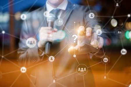 Speaker answers questions from on blurred background.の写真素材