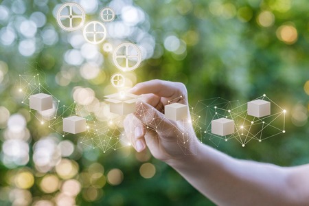 Hand selects a product on blurred background in the network.