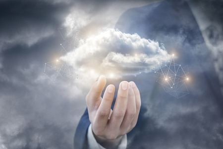 Cloud computing in the hand of a businessman in the sky.