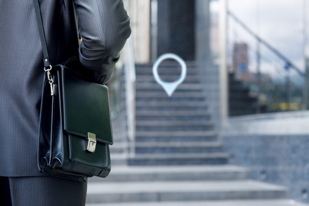 Businessman with a bag goes to the locate point.の写真素材