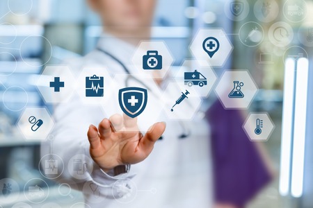 A health worker puts the protection of health on blurred background.の写真素材