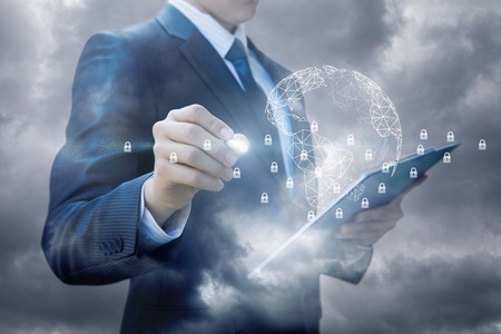 Businessman working in a global secure network against the sky.