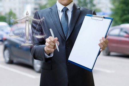 An insurer is suggesting to guarantee a car under fair and profitable conditions. The concept is the importance of insurance.の写真素材