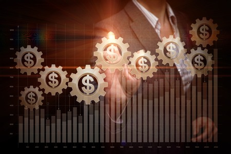 A businesswoman is maintaining with the growth graph consisting of a diagram and cogwheel mechanism with currency unit inside. The concept is the profitable investments.の写真素材