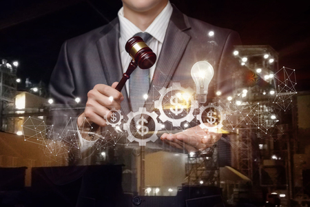 Conducts the auction of innovative and technologically advanced ideas on blurred background.の写真素材