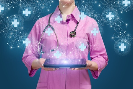 Doctor shows medical network on blue background.の写真素材