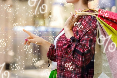 The concept of discounts and the sale . The buyer clicks on flying discounts.の写真素材