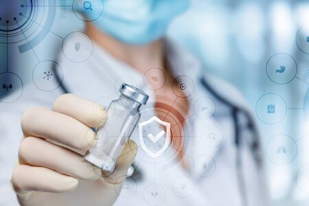 The doctor shows a medicine to protect the health of the patient.の写真素材