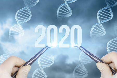 Doctor shows tweezers the numbers 2020. The concept new 2020 year in medicine