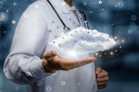The concept of a data cloud in medicine. Doctor shows cloud network.