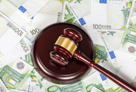 The concept of financial bankruptcy . The judicial hammer on banknotes of euros.の写真素材