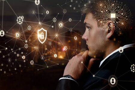 The concept of protecting the business network. Businessman watching over a secure network.の写真素材