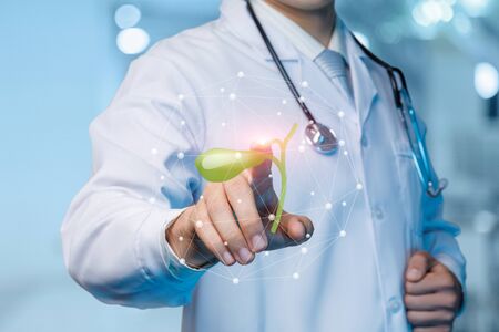 The concept of treatment of the gallbladder. The doctor clicks on the gall bladder on the blurred...