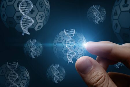 The concept of DNA research . Hand touching DNA molecule on a blue background.