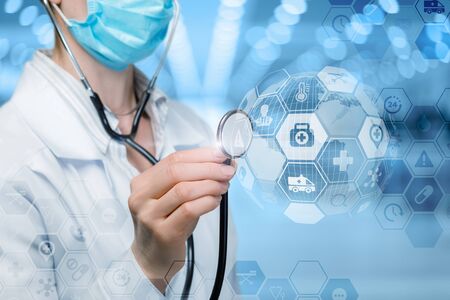 The concept of diagnosis and medical care. The doctor listens to the structure of medical icons.の写真素材