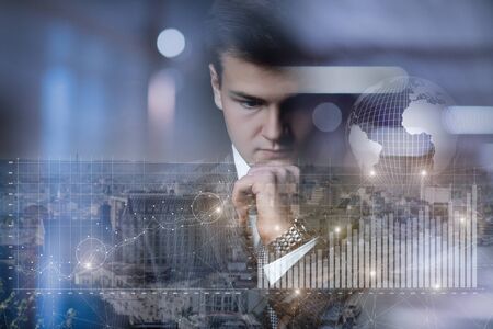 The concept of financial profit and a successful business. Young businessman analyzes the statistics of financial growth.の写真素材