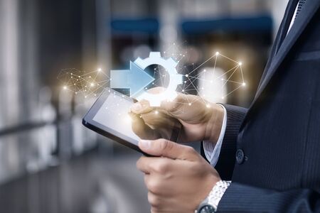 The concept of integrate in the business. Businessman showing on the tablet the icon of the integrate .の写真素材