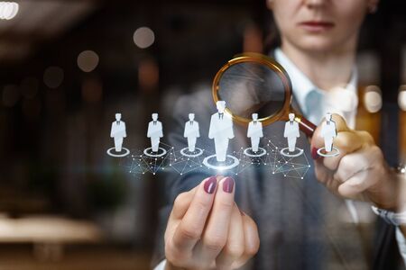 The businesswoman chooses the worker to perform the job .の写真素材