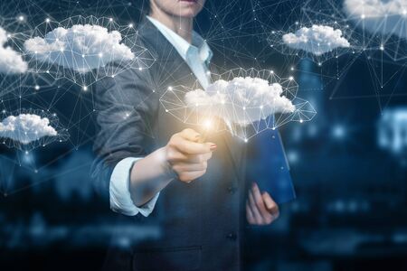 Businessman running in a network cloud data on a dark background.の写真素材
