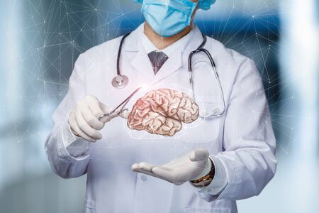 The concept of treating the brain of a patient. The doctor shows the brain.