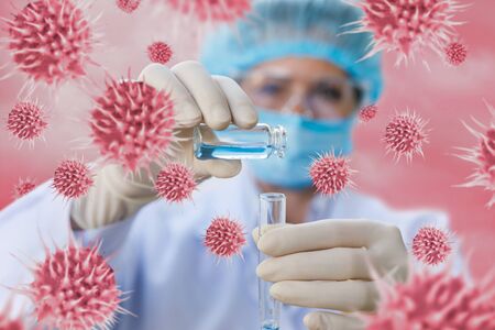 The concept of research searching for a vaccine against the virus.The laboratory assistant pours the...