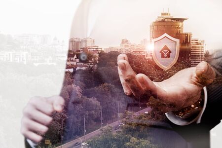 The concept of wireless security. Hand shows a shield with a wireless icon.の写真素材