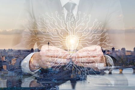 Concept of Idea and Artificial Brainstorming. Businessman with a light bulb and a burning artificial...