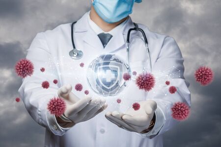 The concepts of protecting the world from a virus and a pandemic.の写真素材