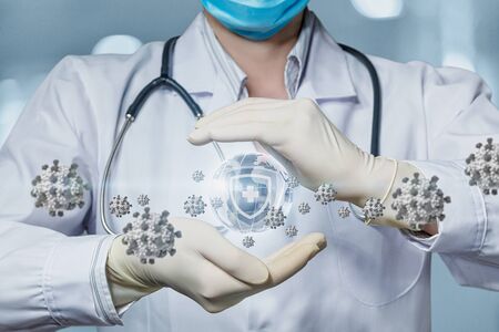 The concept of medical protection against the spread of the virus on planet Earth.の写真素材