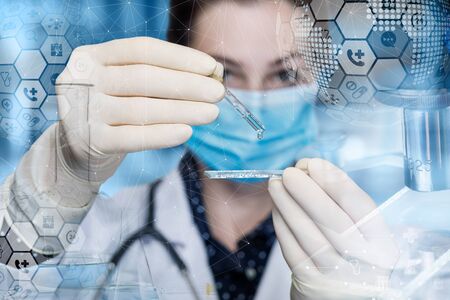 Concept of medical experiment or research. The doctor is conducting an experiment with a medical sample.の写真素材