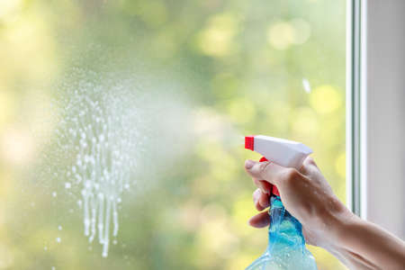 The concept of window cleaning.Cleaner spray on window cleaner.の写真素材