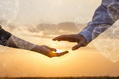 The concept of recognition of love and romantic feelings on a sunset background.の写真素材