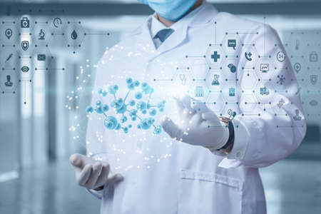Molecular research concepts in medicine. The doctor clicks on a molecule on a blurred background.