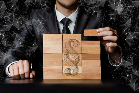 Businessman can composing a paragraph block on a dark background.