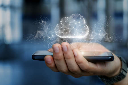 Hand with a mobile phone shows a cloud of data on a blurred background.
