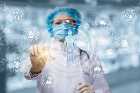 The doctor conducts research testing the patient on a virtual screen.の写真素材