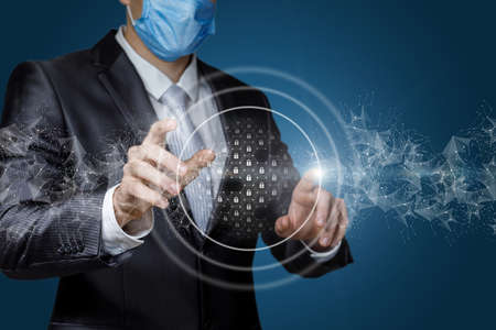 The businessman connects the security system on a virtual screen.の写真素材