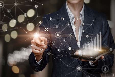 Businesswoman working network analyzing graphs of economic and financial growth.