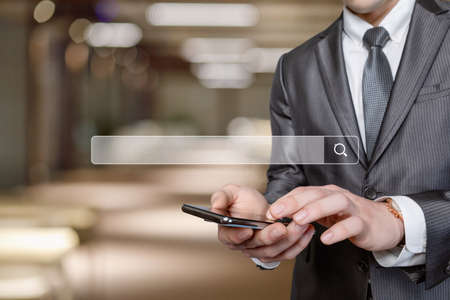 Business man running on virtual screen with search query bar.